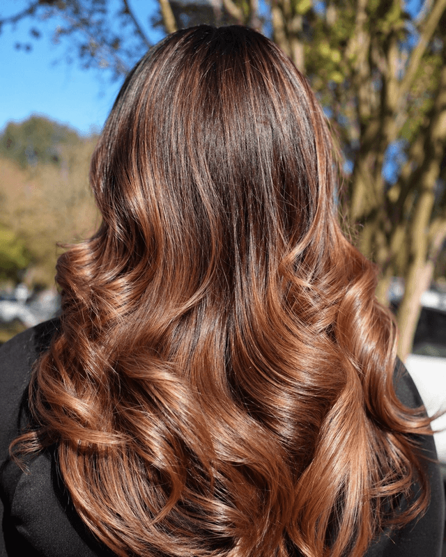 Wavy layers on long hair by Jennifer Nesbit