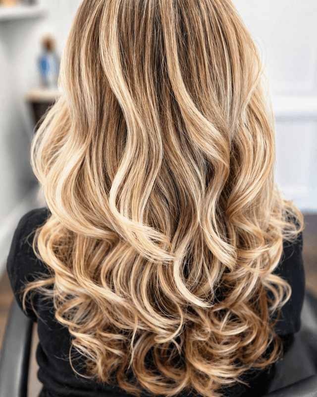 Wavy layers on long hair by Jennifer Nesbit